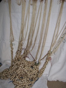Chains of pale gold pile.  Shades of Rapunzel and Rumpelstiltskin.